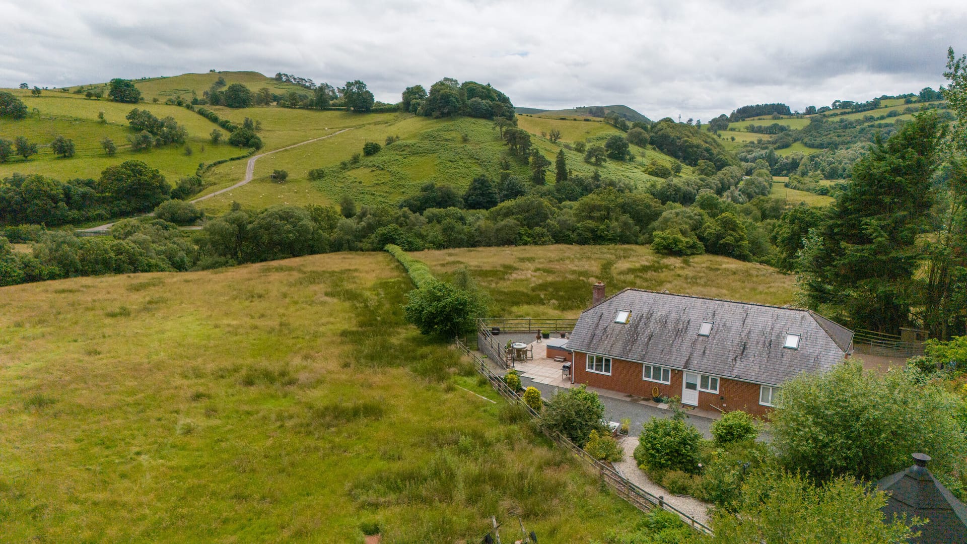 Aerial view of Castle View Lodge in its hillside setting